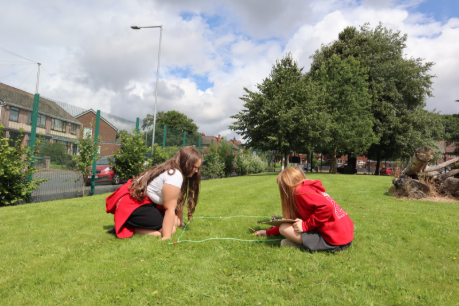 An image of learners surveying thier grass