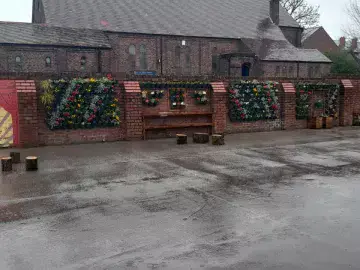 School playground with planters attached to the wall