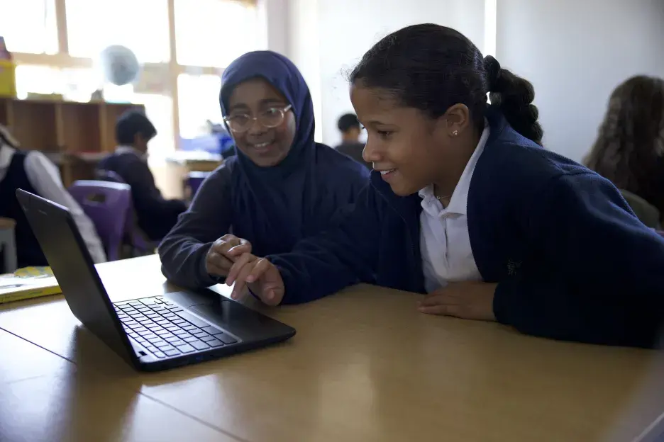 Pupils look at a laptop