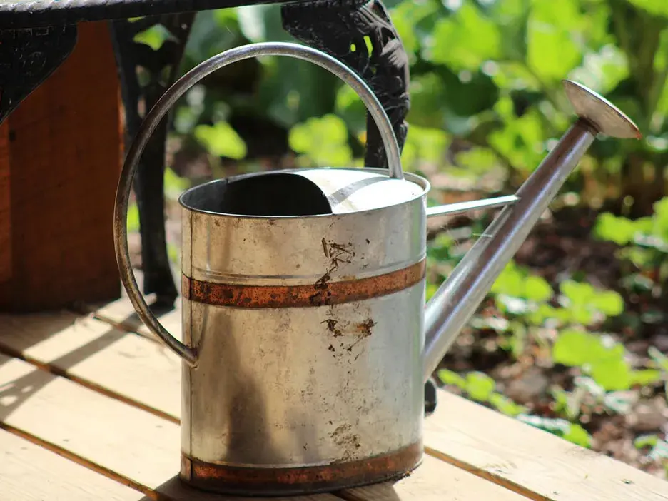A metal watering can