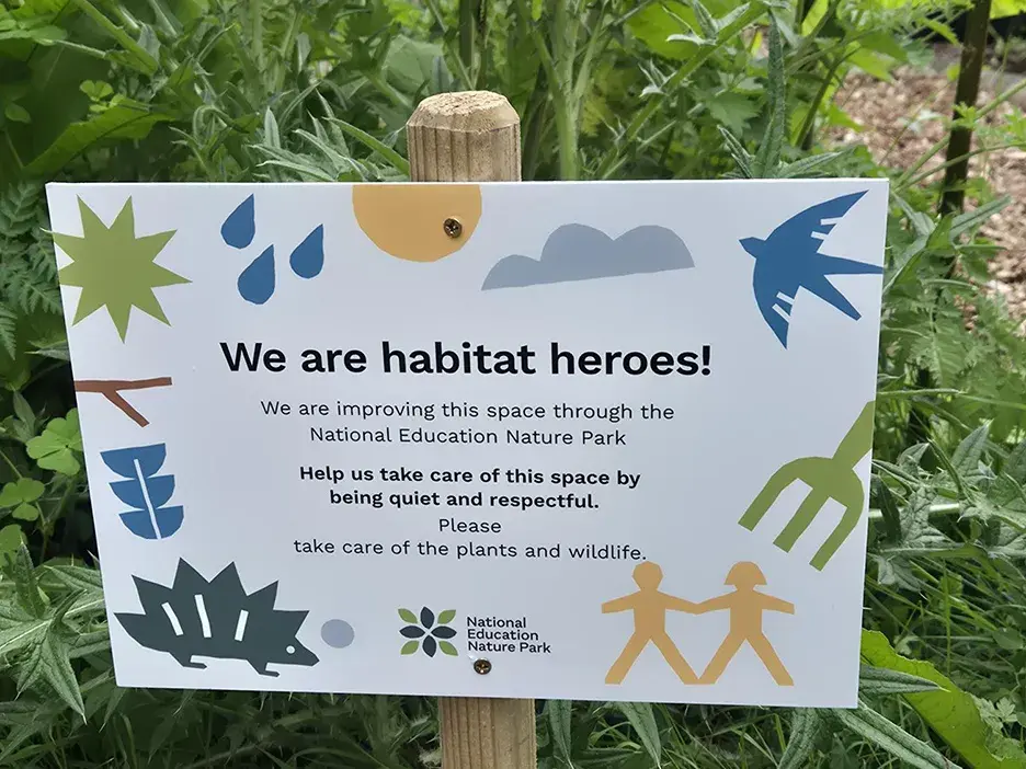 A National Education Nature Park sign in a school garden