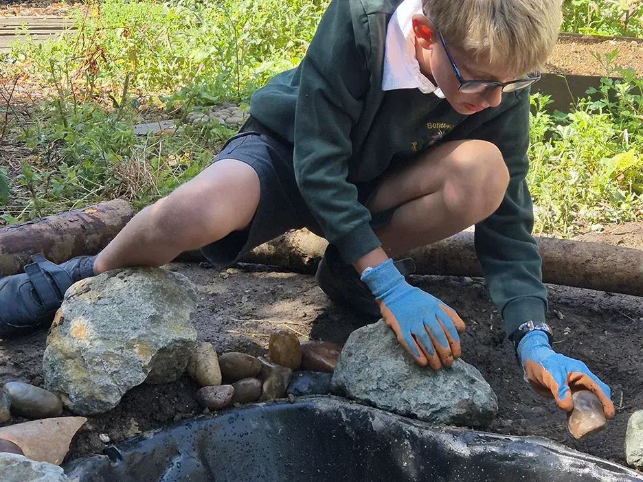 A learner creating pond habitat