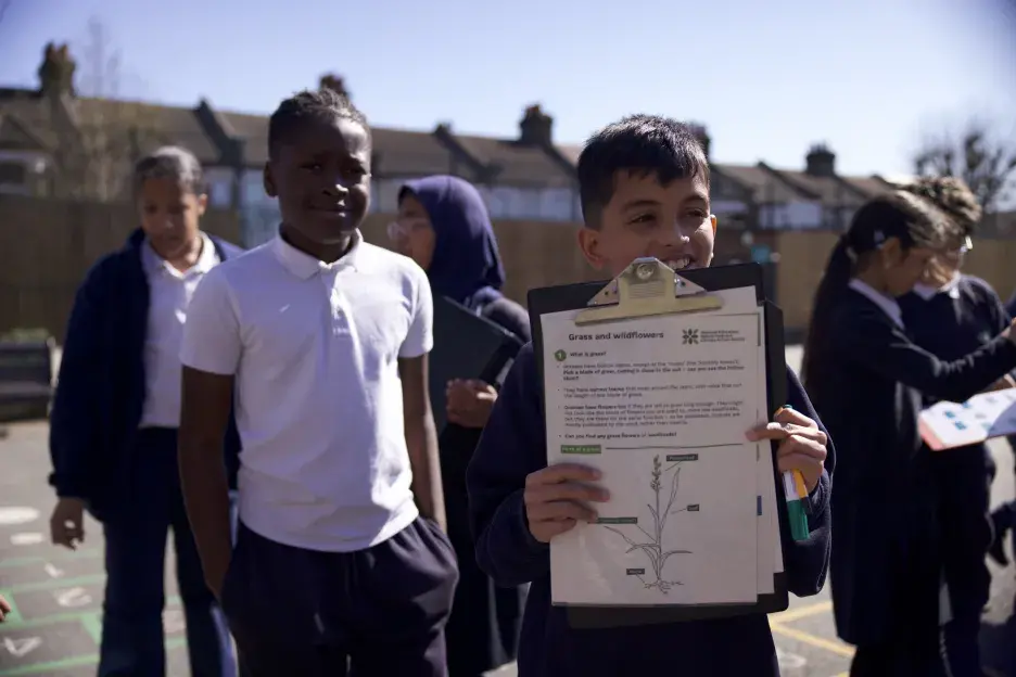 two children with a clipboard
